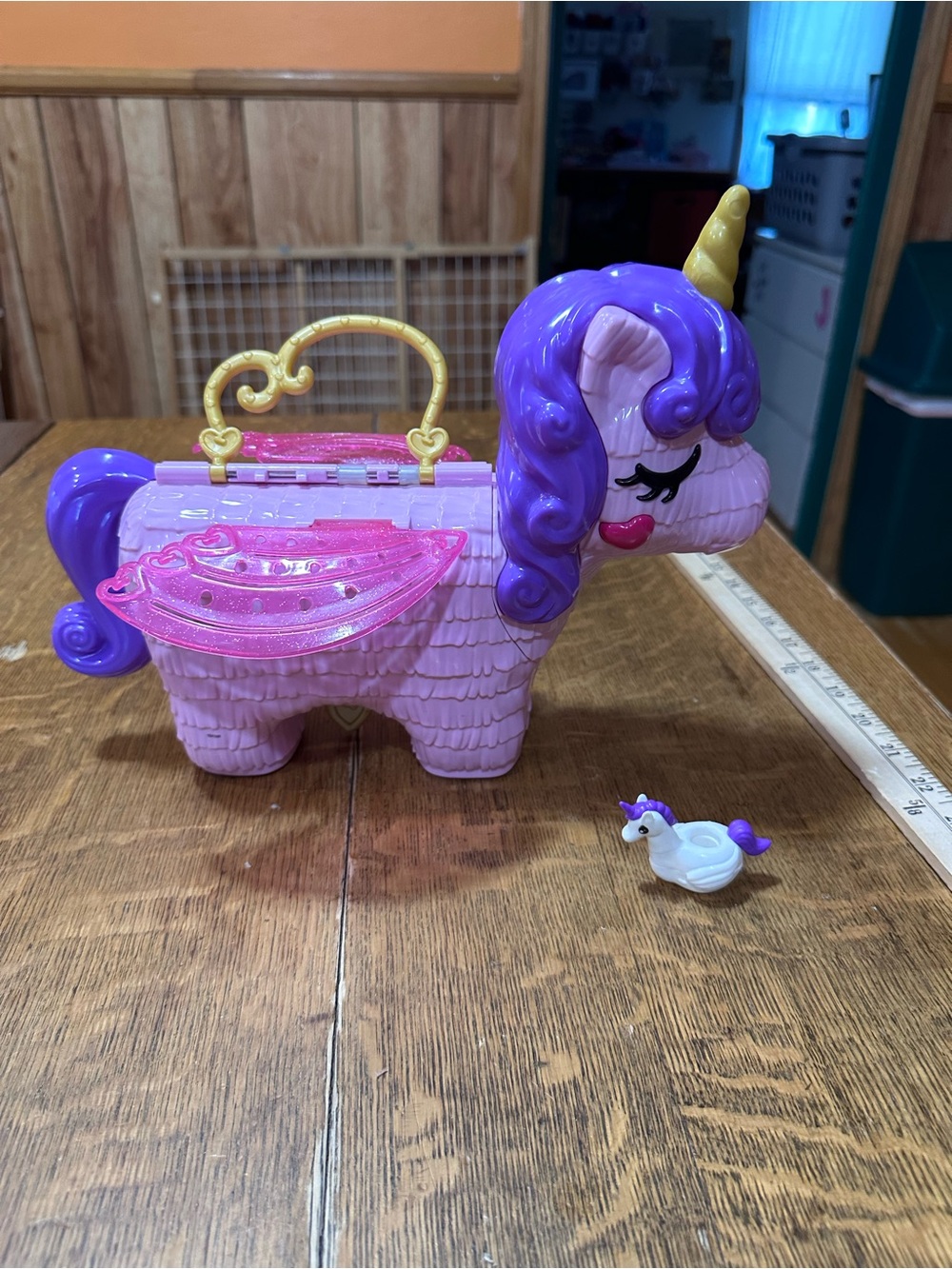 Polly Pocket Unicorn Party Piñata Playset, a pink-and-purple, piñata-shap